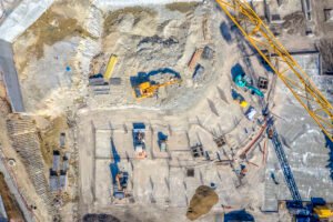 construction equipment working at the construction site. aerial view from drone