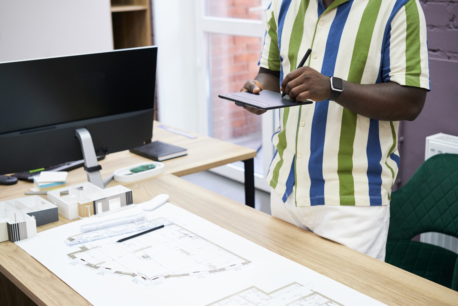 graphic designer working on tablet at office